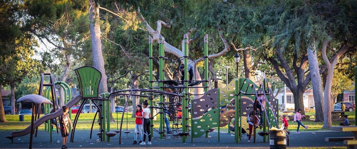 Children playing in a park in South Gate